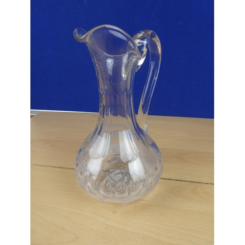 552 - A vintage glass jug.