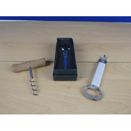 554 - A boxed crystal bottle stopper and two bottle openers.