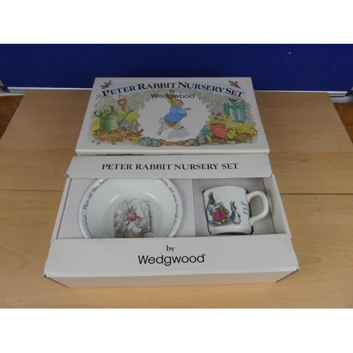 571 - A boxed Peter Rabbit nursery set.