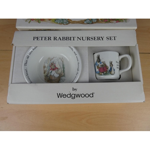 571 - A boxed Peter Rabbit nursery set.