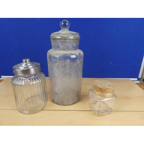 578 - A lidded glass container and two others.