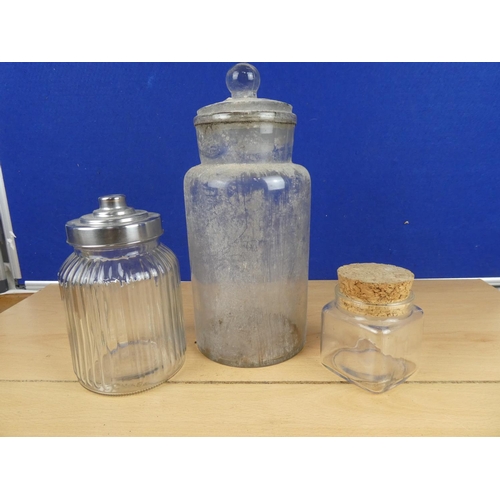 578 - A lidded glass container and two others.