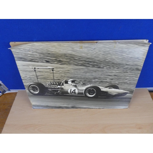 579 - A picture of Jackie Stewart racing car mounted on board.