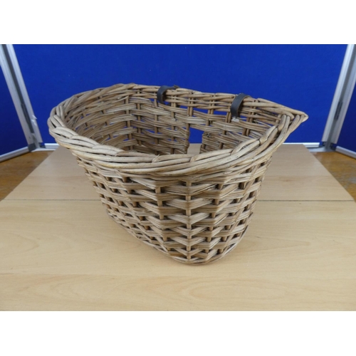 582 - A vintage wicker bicycle basket.