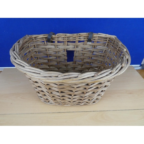 582 - A vintage wicker bicycle basket.