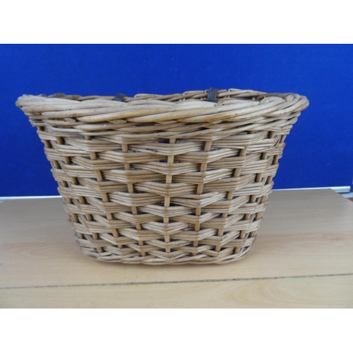 582 - A vintage wicker bicycle basket.