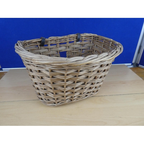 582 - A vintage wicker bicycle basket.