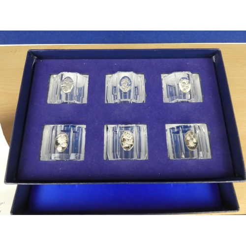 586 - A stunning boxed Franklin Mint set of 6 'Flower' napkin rings with certificate.