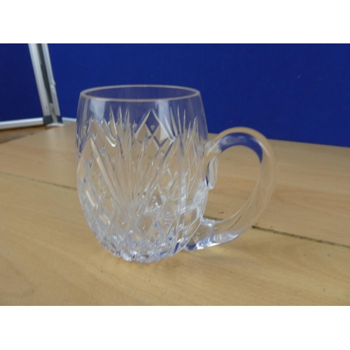 590 - A large crystal glass tankard.