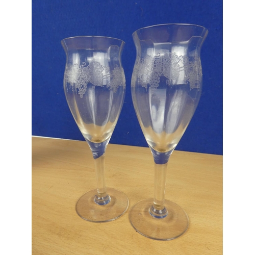 596 - Two etched wine glasses and decanter.