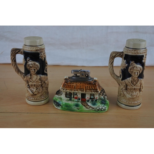 600 - An Irish cottage lighter and a pair of ceramic salt and pepper shakers.