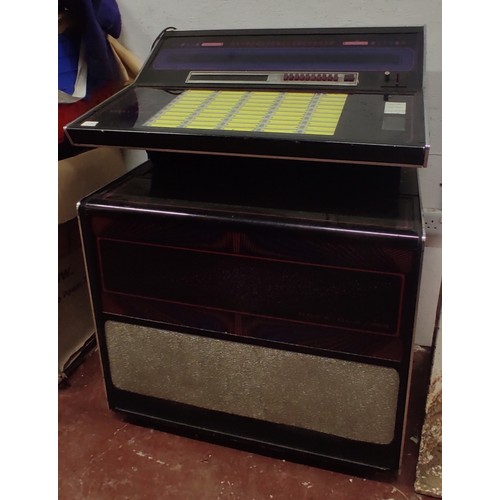 426 - A Rock-ola Integrated circuit / solid state / stereophonic music system juke box.