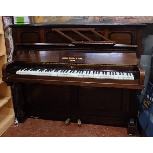 502 - A George Rogers and Sons upright piano made in London.