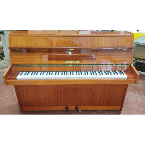 583 - A Zimmerman upright piano.