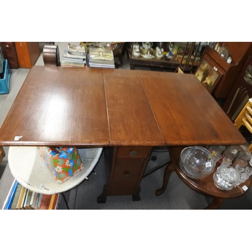 392 - A vintage mahogany dropleaf table with with drawers to the side.