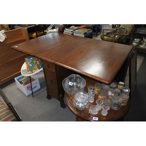 392 - A vintage mahogany dropleaf table with with drawers to the side.