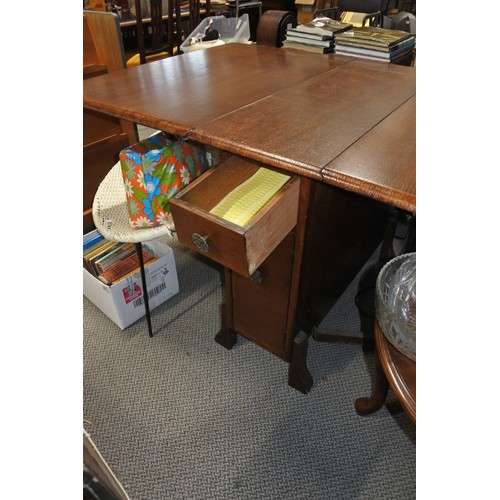 392 - A vintage mahogany dropleaf table with with drawers to the side.