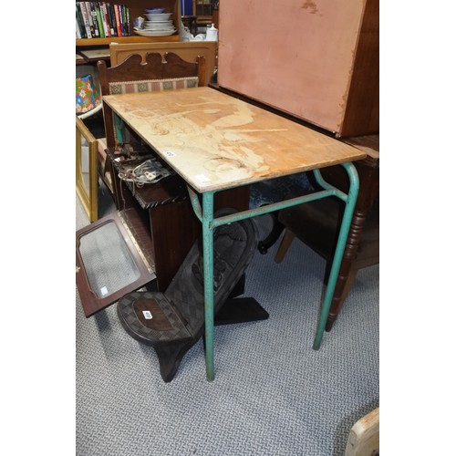 410 - A vintage metal based work table.