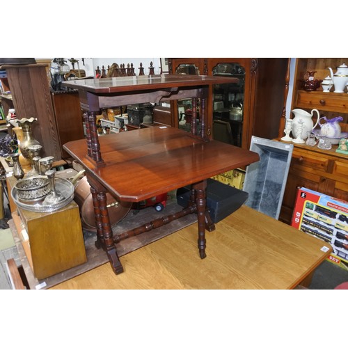 466 - An antique double sutherland table on casters.