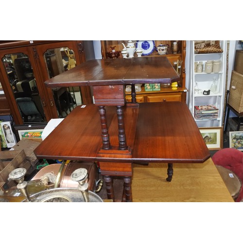 466 - An antique double sutherland table on casters.