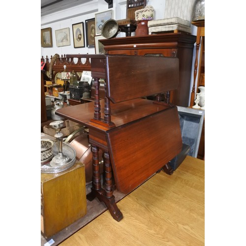 466 - An antique double sutherland table on casters.