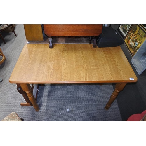 484 - A small, slim dining room table.