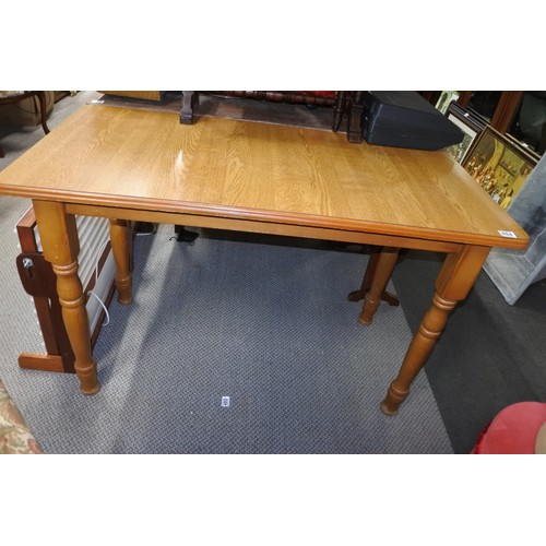 484 - A small, slim dining room table.