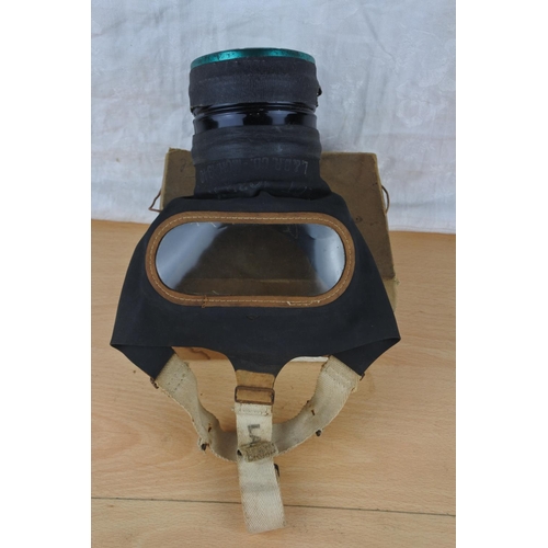 32 - A vintage boxed gas mask.