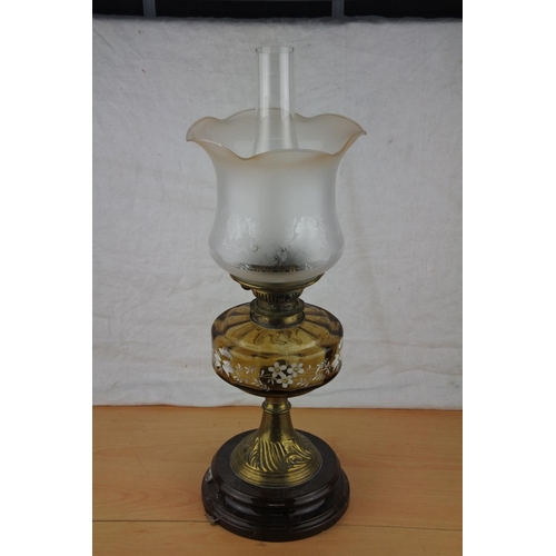 74 - A stunning antique oil lamp with hand painted tinted glass font. Approx 57cm.