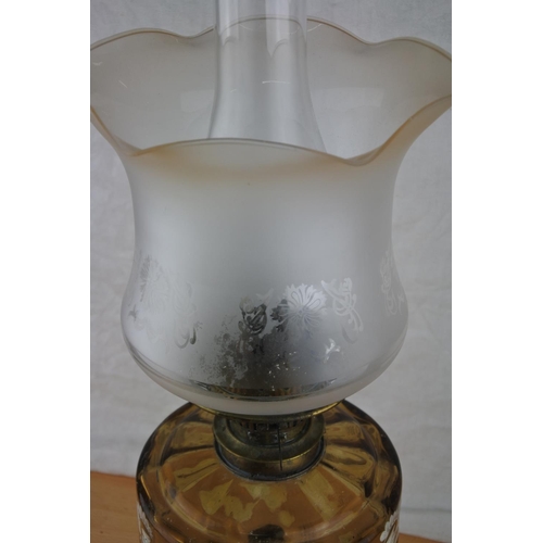 74 - A stunning antique oil lamp with hand painted tinted glass font. Approx 57cm.