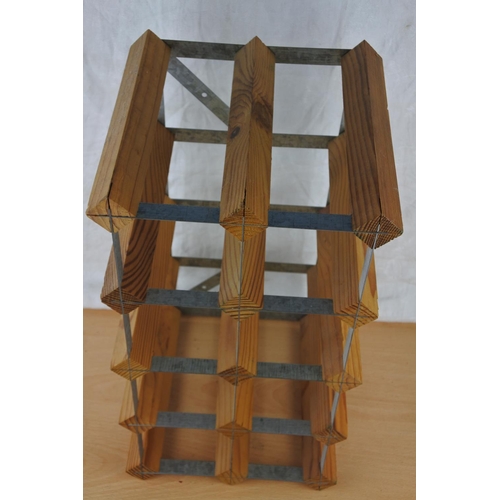 76 - A wood and metal eight bottle wine rack.