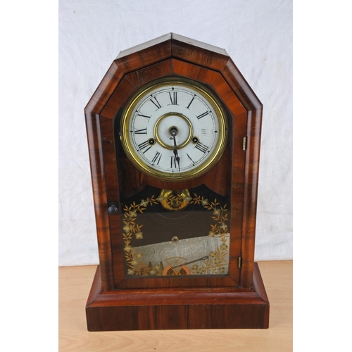 77 - A stunning antique mahogany cased mantle clock. Approx 45cm.