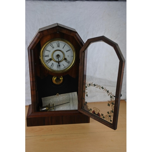 77 - A stunning antique mahogany cased mantle clock. Approx 45cm.