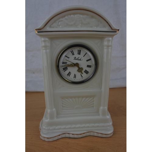 80 - A Belleek pottery mantle clock.