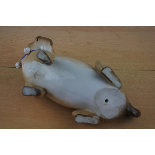 82 - An antique ceramic pug dog figure.