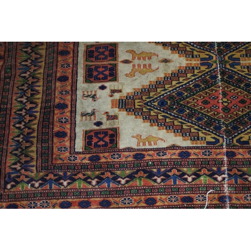 93 - A decorative floor rug with camel detail. Approx 119x178cm.