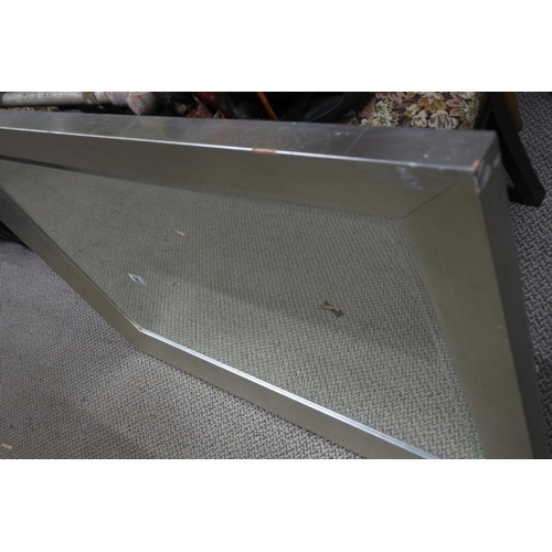 96 - A large modern silvered framed mirror. Approx 105x75cm.