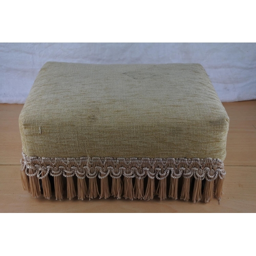 104 - A small upholstered footstool.