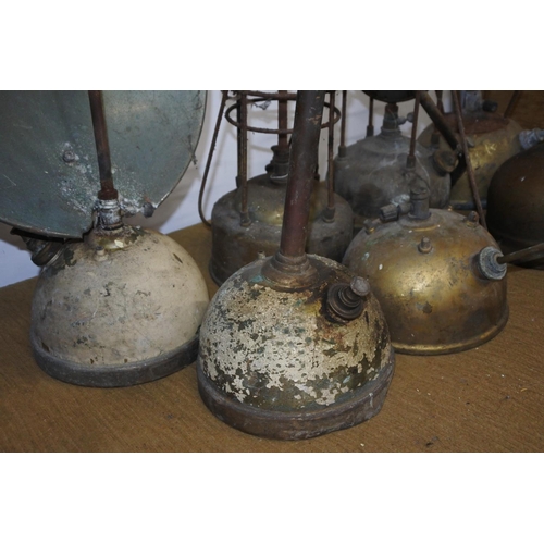 112 - A large lot of vintage tilley and radiator lamps in need of restoration.