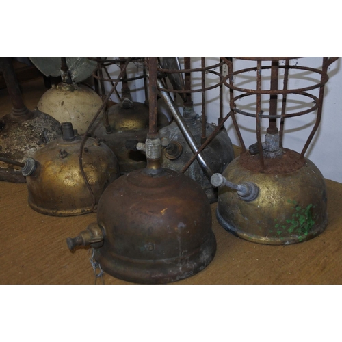 112 - A large lot of vintage tilley and radiator lamps in need of restoration.