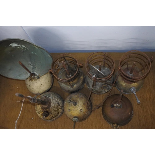 112 - A large lot of vintage tilley and radiator lamps in need of restoration.