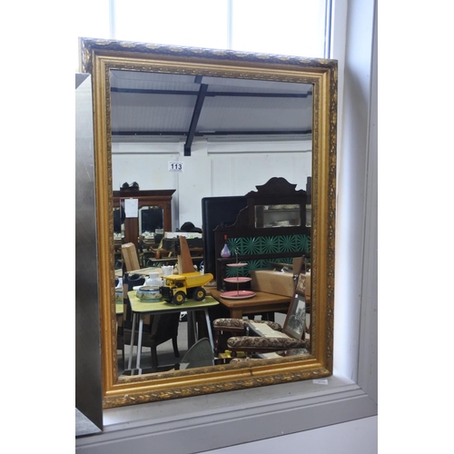 113 - A gilt framed wall mirror. Approx 62x84cm.