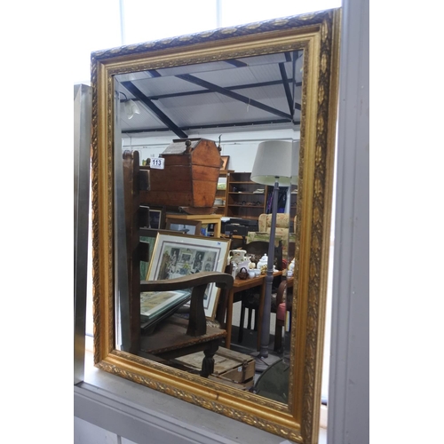 113 - A gilt framed wall mirror. Approx 62x84cm.