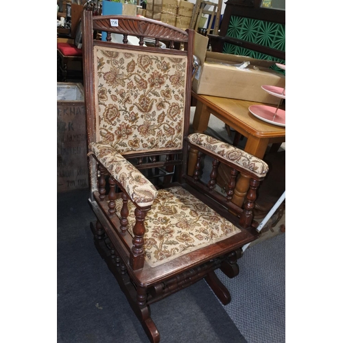 114 - An antique rocking chair in need of restoration.