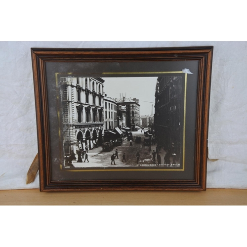 115 - An antique street scene of the Cornmarket, Belfast. Approx 34x29cm.