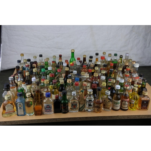 118 - A large quantity of miniature whiskey and spirit bottles (a/f).