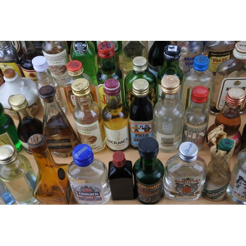 118 - A large quantity of miniature whiskey and spirit bottles (a/f).