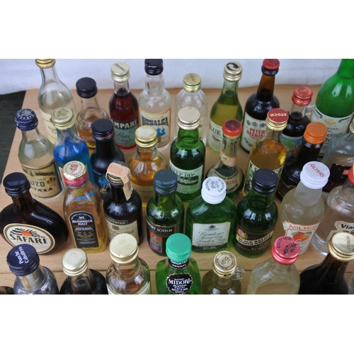 118 - A large quantity of miniature whiskey and spirit bottles (a/f).