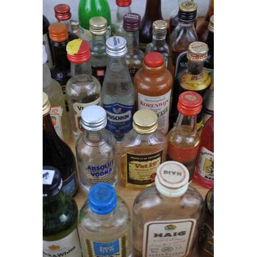 118 - A large quantity of miniature whiskey and spirit bottles (a/f).