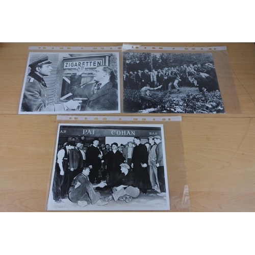 570 - An interesting lot of black and white movie stills photos including two featuring scenes from The Qu... 